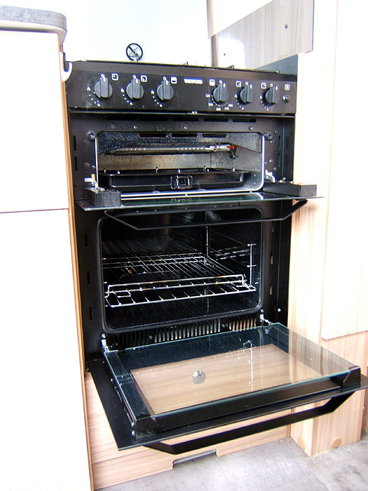 The hob unit with 4 gas burners and controls to the side.